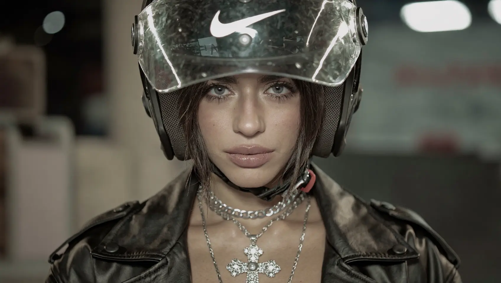 Editorial portrait wearing a transparent racing helmet